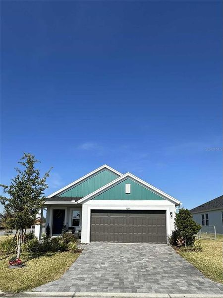 Front exterior of a new home in Cherrywood Preserve, Ocala, FL, highlighting curb appeal (Image 1).