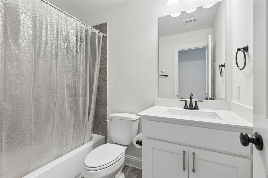 White vanity with a rectangular undermount sink, a white countertop, and matte black faucet