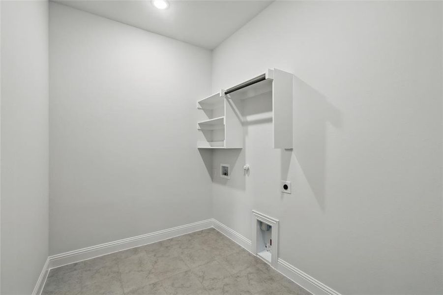 Clothes washing area featuring washer hookup, laundry area, gas dryer hookup, baseboards, and electric dryer hookup