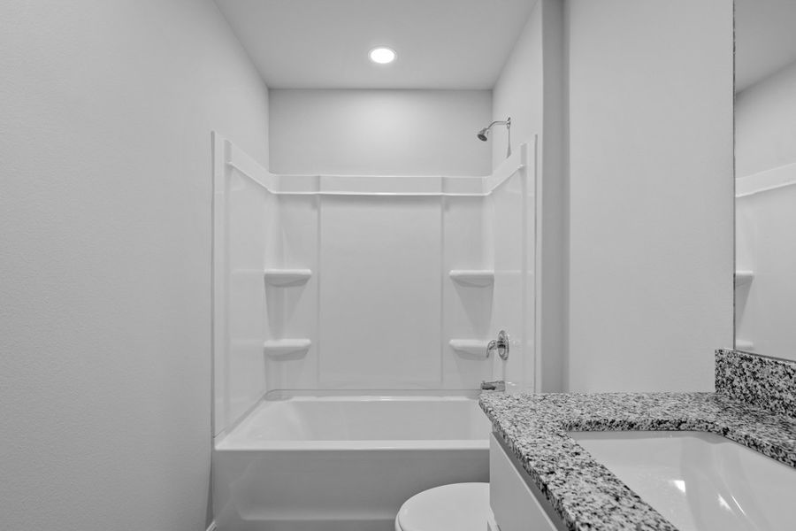 Representative furnished interior of a home built from the BELLVUE by D.R. Horton in Faculty Row, Abilene (Image 30).