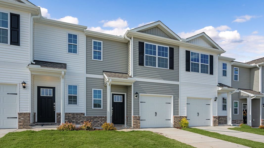 Front exterior of a new home in The Townes at Prestleigh, Wake Forest, NC, highlighting curb appeal (Image 2). Front exterior of a new home in The Townes at Prestleigh, Wake Forest, NC, highlighting curb appeal (Image 2).
