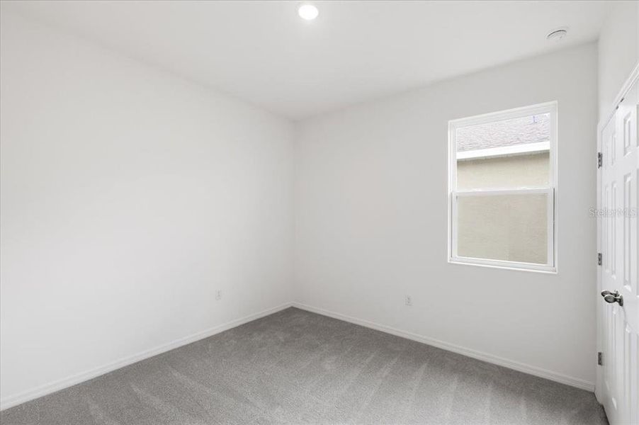 Spacious, unfurnished interior of a new home in Highfield at Twisted Oaks, Wildwood (Image 9).