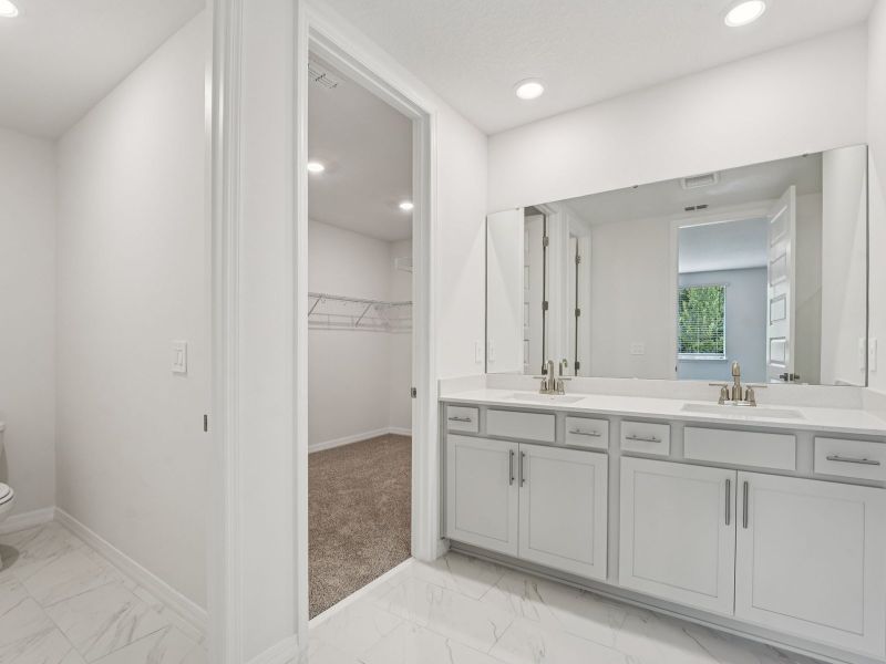 Furnished interior view inside a new home in The Grove at Stuart Crossing - Signature Series, Bartow (Image 6).