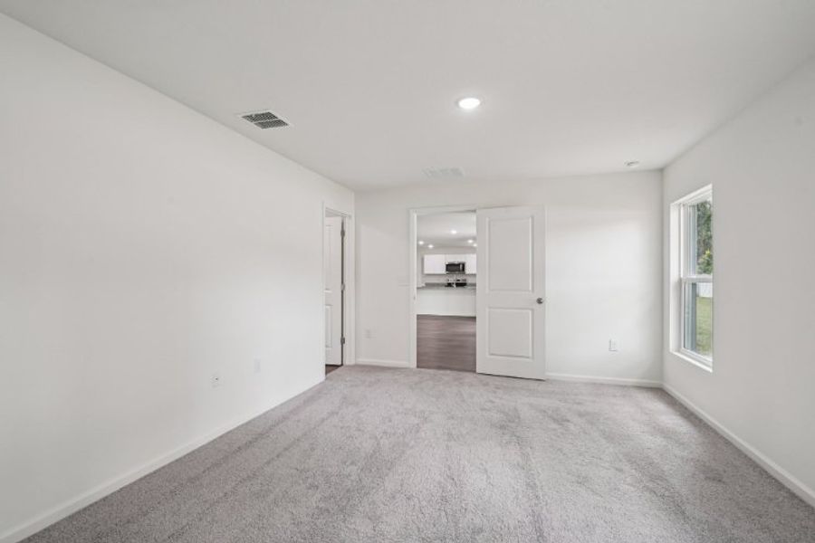 A hallway with white walls.