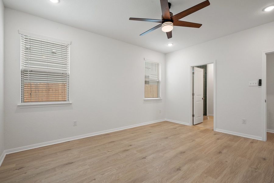 Spacious, unfurnished interior of a new home in The Hills of Bear Creek, Manchaca (Image 16).