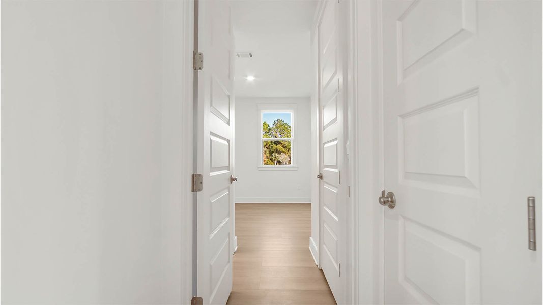 Representative unfurnished interior of a home built from the Trenton by D.R. Horton in Parkside, Santa Rosa Beach (Image 16).