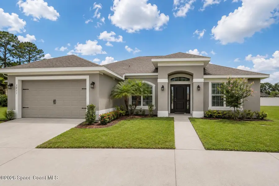 Front exterior of a new home in Palm Bay, Palm Bay, FL, highlighting curb appeal (Image 1). Front exterior of a new home in Palm Bay, Palm Bay, FL, highlighting curb appeal (Image 1).
