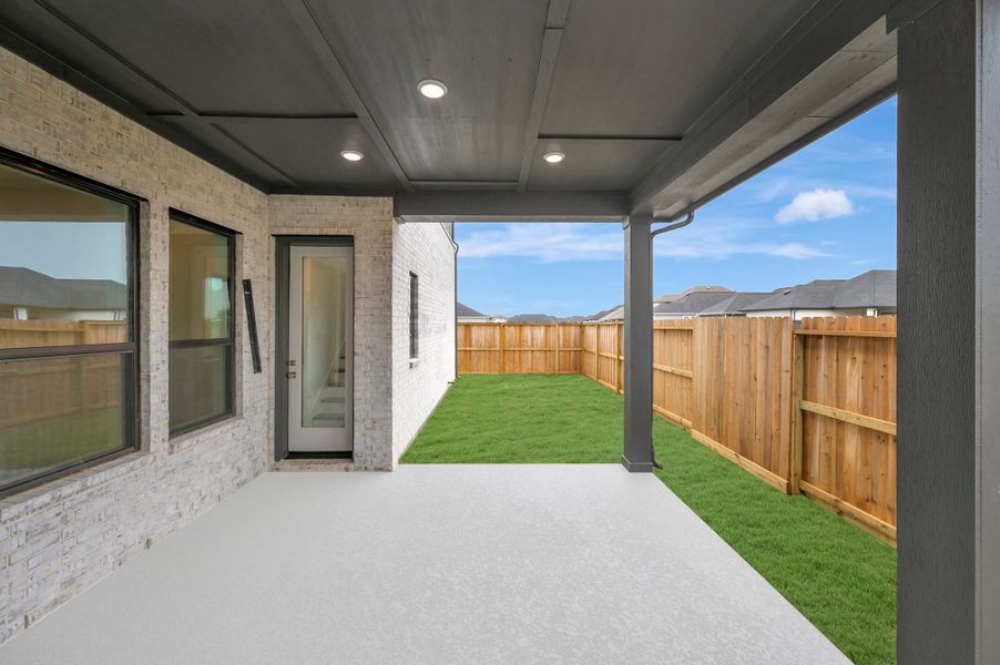 Exterior details and patio area of a home in Riceland - Enclave Row Collection, Mont Belvieu (Image 3).