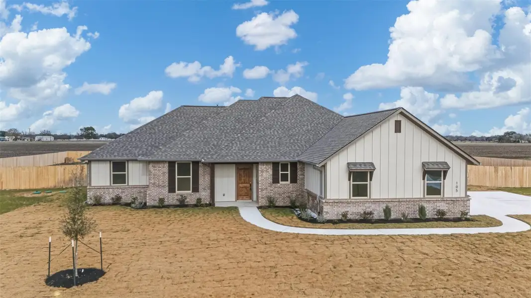 Front exterior of a new home in , Snook, TX, highlighting curb appeal (Image 24). Front exterior of a new home in , Snook, TX, highlighting curb appeal (Image 24).