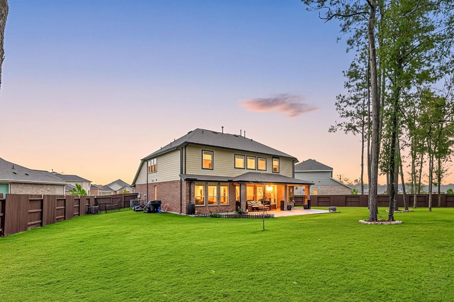 Exterior details and patio area of a home in ARTAVIA: Fairway Collection, Conroe (Image 29).