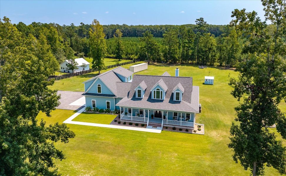Front exterior of a new home in , Ravenel, SC, highlighting curb appeal (Image 2). Front exterior of a new home in , Ravenel, SC, highlighting curb appeal (Image 2).