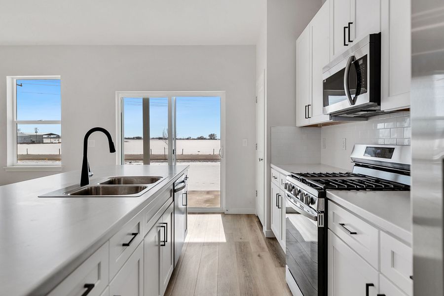 Representative furnished interior of a home built from the Stratton by Baessler Homes in Hudson Hills, Hudson (Image 11).