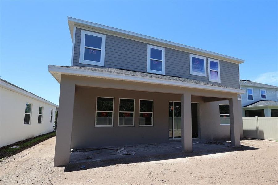 Exterior details and patio area of a home in Bay Lake Farms, St. Cloud (Image 3).