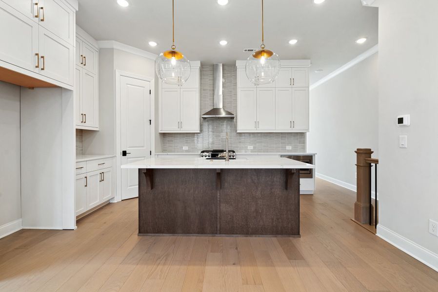 Representative furnished interior of a home built from the 
                        
                         by The Providence Group in Ward's Crossing Townhomes, Johns Creek (Image 11).