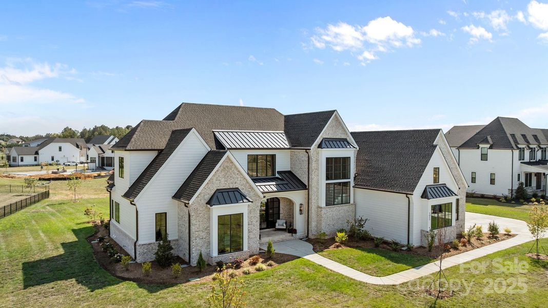Front exterior of a new home in Broadmoor at Marvin, Marvin, NC, highlighting curb appeal (Image 1). Front exterior of a new home in Broadmoor at Marvin, Marvin, NC, highlighting curb appeal (Image 1).