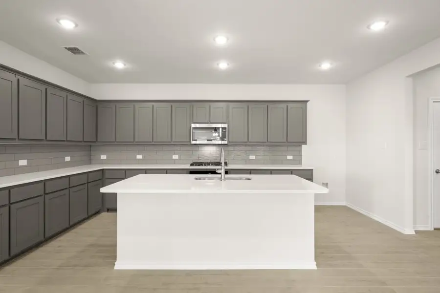 Front exterior of a new home in Myrtle Creek, Waxahachie, TX, highlighting curb appeal (Image 7). Front exterior of a new home in Myrtle Creek, Waxahachie, TX, highlighting curb appeal (Image 7).