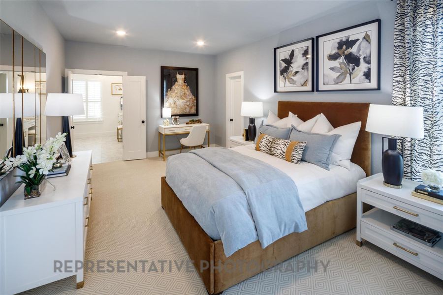 Bedroom with recessed lighting, ensuite bath, and light carpet