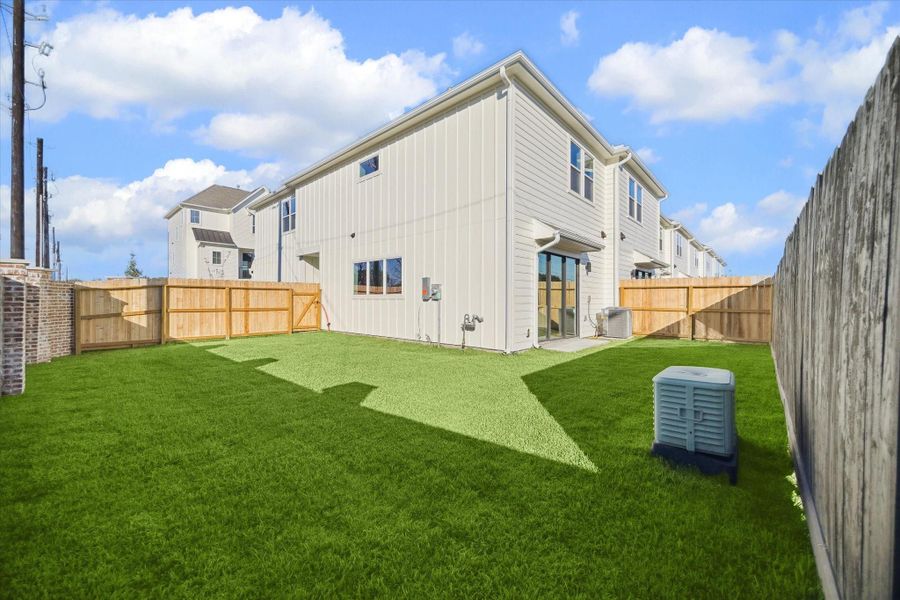 A private fenced backyard provides huge outdoor space perfect for relaxing or entertaining.