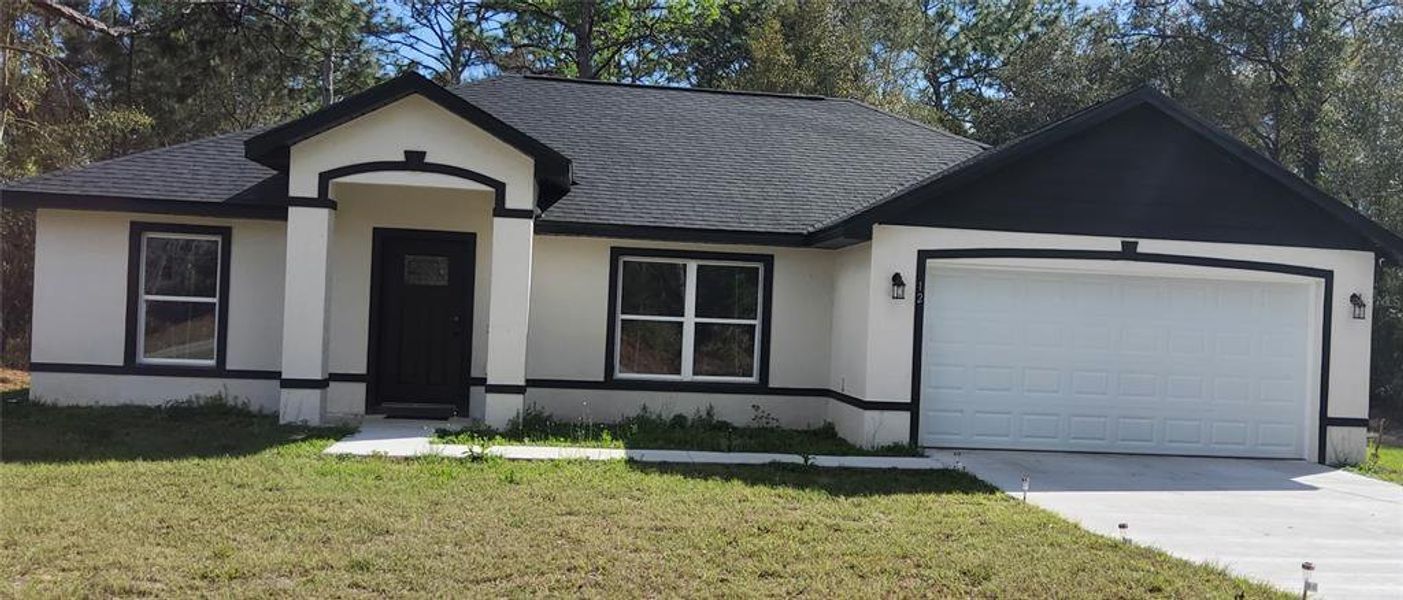 Front exterior of a new home in , Ocklawaha, FL, highlighting curb appeal (Image 23).