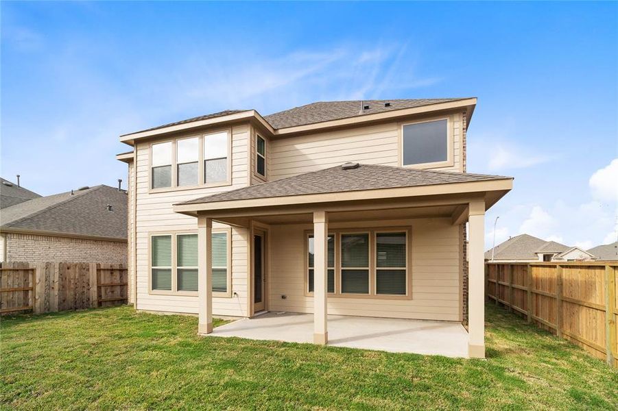 Come and see this spacious backyard with its beautiful covered patio. There is plenty of room for the kids to play and adults to relax!