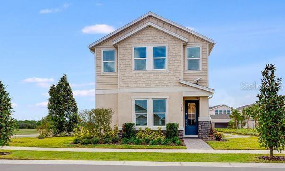 Front exterior of a new home in Center Lake Ranch Community Group Page, St. Cloud, FL, highlighting curb appeal (Image 17).