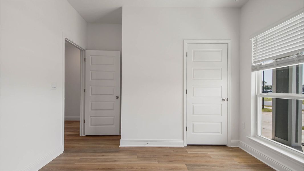 Representative unfurnished interior of a home built from the Rhett by D.R. Horton in Caballeros Estates At Hombre, Panama City Beach (Image 24).