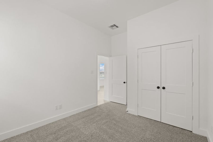 Representative unfurnished interior of a home built from the Pinehurst by Chesmar Homes in Riceland Alley Loads, Mont Belvieu (Image 17).