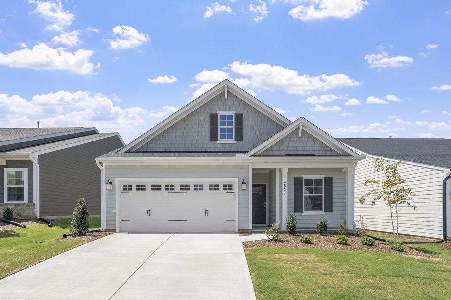 Front exterior of a new home in Ovation at Sweetbrier, Durham, NC, highlighting curb appeal (Image 1). Front exterior of a new home in Ovation at Sweetbrier, Durham, NC, highlighting curb appeal (Image 1).