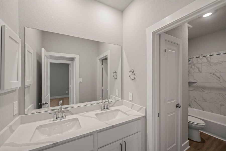 Fresh, modern bathrooms featuring quality finishes and bright lighting. Fresh, modern bathrooms featuring quality finishes and bright lighting.