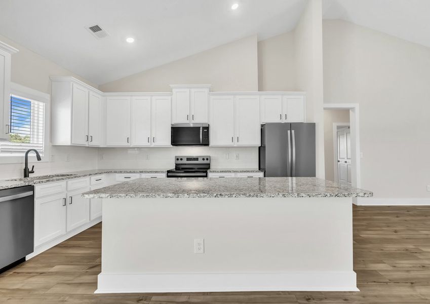 The kitchen has a spacious kitchen island.