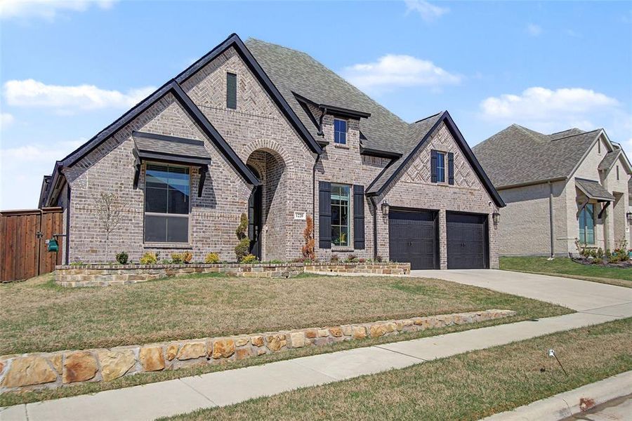 Front exterior of a new home in Devonshire, Forney, TX, highlighting curb appeal (Image 25).