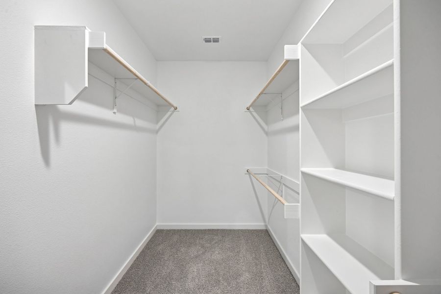Primary Closet in the Heisman home plan by Trophy Signature Homes – REPRESENTATIVE PHOTO