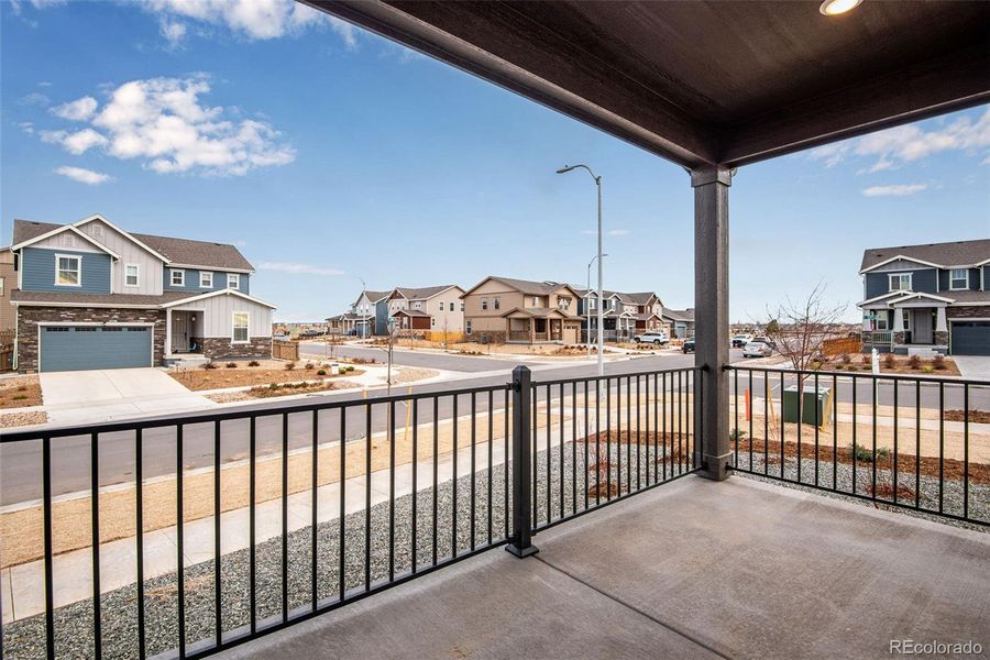 Exterior details and patio area of a home in Painted Prairie, Aurora (Image 26).