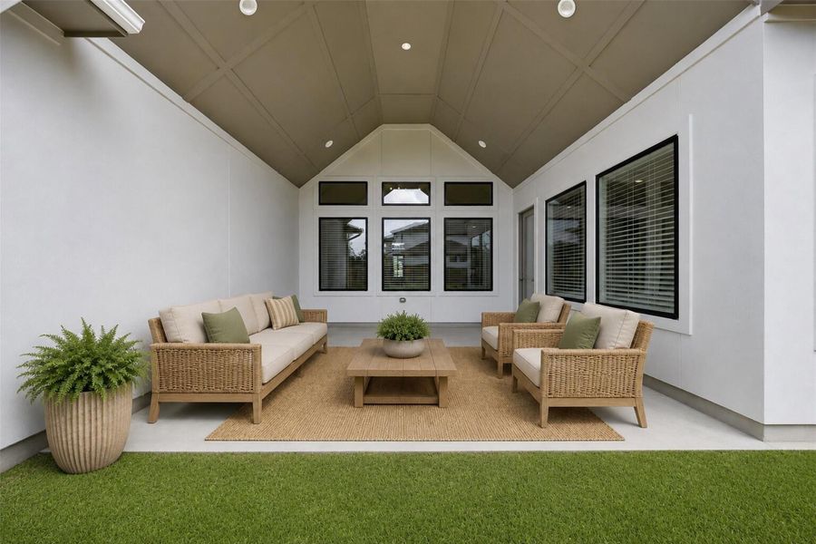 **Virtually Staged** Expansive covered outdoor living area featuring vaulted ceilings and seamless indoor-outdoor flow - ideal for entertaining year-round.