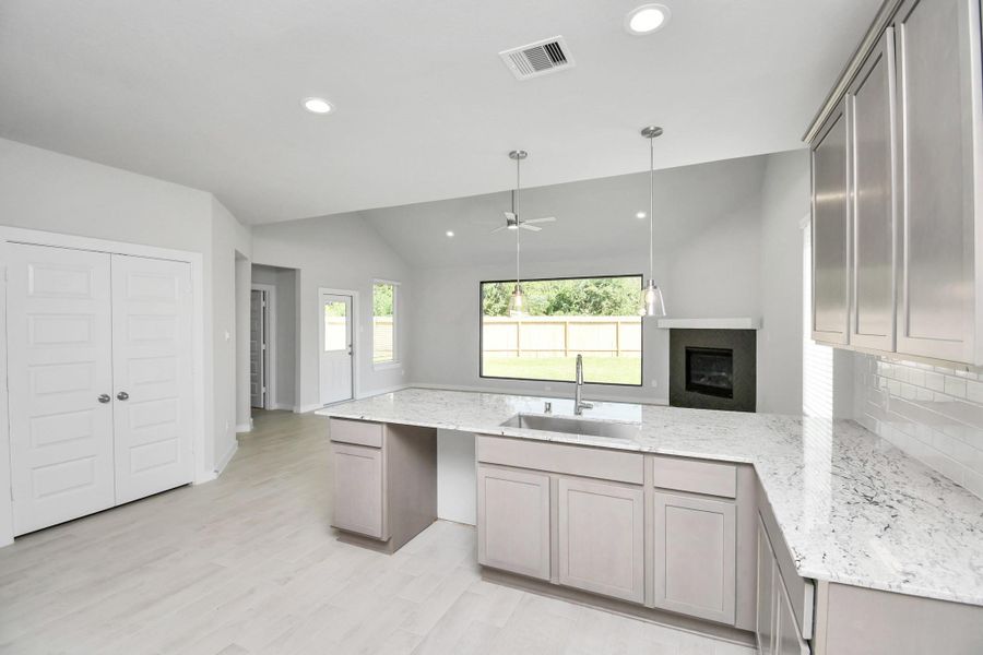 This generously spacious kitchen is a dream realized! Sample photo of completed home with similar floor plan. Actual colors and selections may vary.