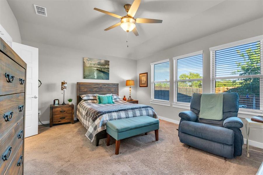 Bedroom featuring ceiling fan and carpet