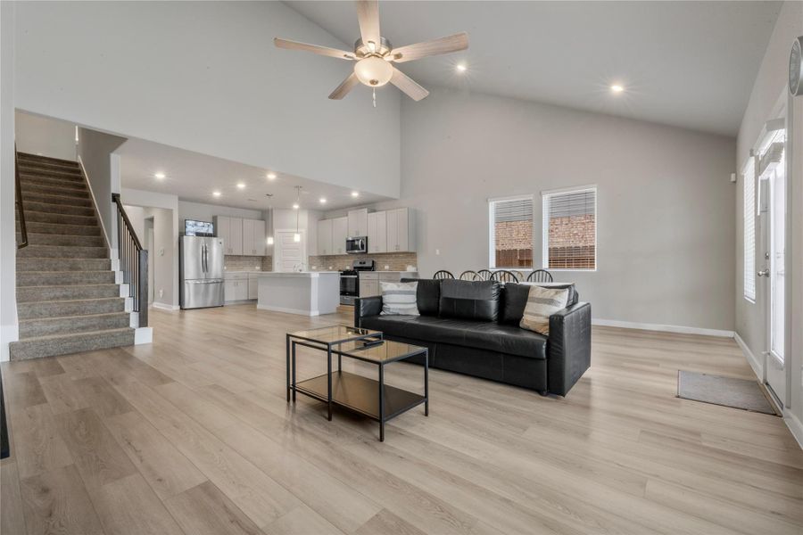 Spacious and light-filled living area designed for comfort and everyday living. The open layout provides ample room for seating and entertainment, with large windows that allow natural light to flow throughout the space.