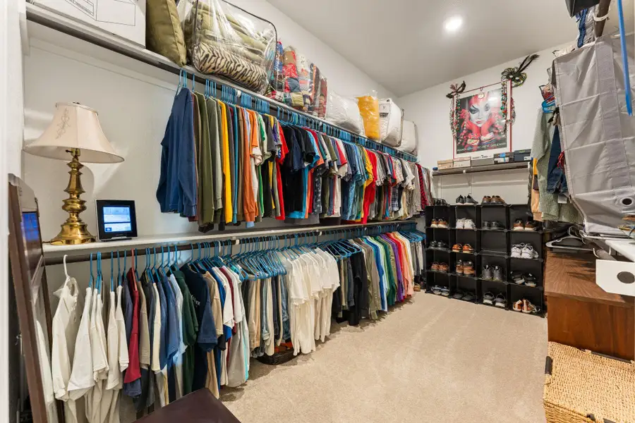 This is the larger of the two primary walk-in closets. This is the larger of the two primary walk-in closets.