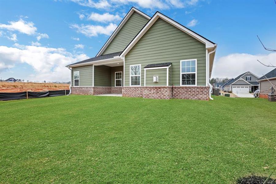 Exterior details and patio area of a home in Newberry 55+, McDonough (Image 2).