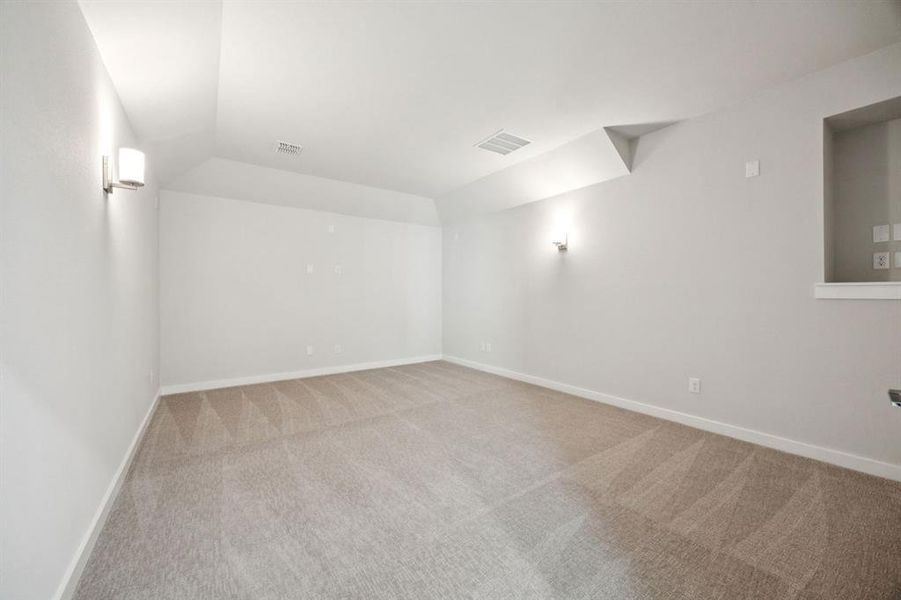 Media Room in the Wimbledon home plan by Trophy Signature Homes – REPRESENTATIVE PHOTO Media Room in the Wimbledon home plan by Trophy Signature Homes – REPRESENTATIVE PHOTO