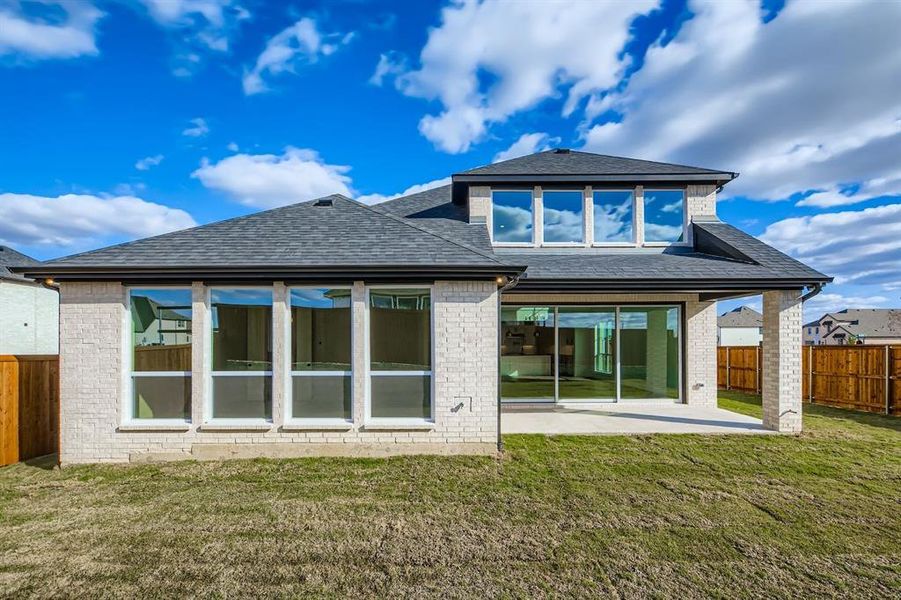 Exterior details and patio area of a home in Wildridge, Oak Point (Image 4).
