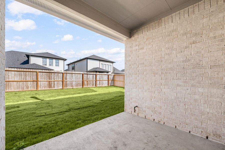 Exterior details and patio area of a home in Harvest Green, Richmond (Image 28). Exterior details and patio area of a home in Harvest Green, Richmond (Image 28).