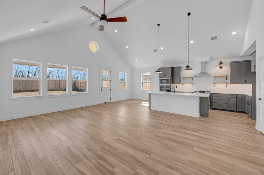 Bright and open living area with vaulted ceilings