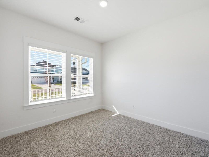 Spacious, unfurnished interior of a new home in The Coves at Lakes of Cane Bay, Summerville (Image 22).