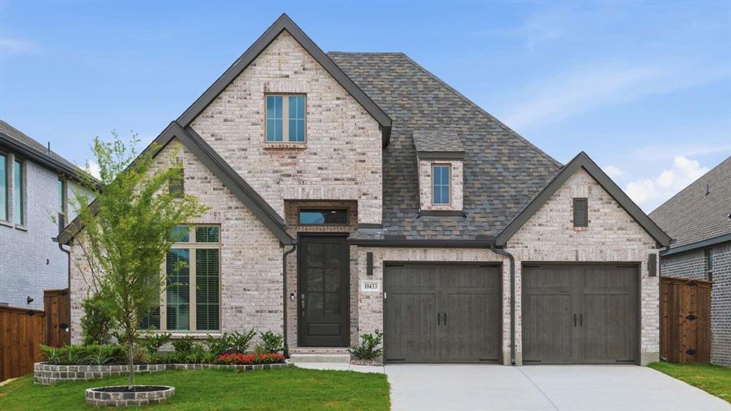 Front exterior of a new home in Ventana, Fort Worth, TX, highlighting curb appeal (Image 1). Front exterior of a new home in Ventana, Fort Worth, TX, highlighting curb appeal (Image 1).