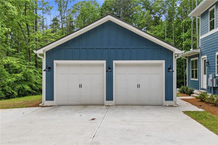 Front exterior of a new home in , Holly Springs, GA, highlighting curb appeal (Image 30). Front exterior of a new home in , Holly Springs, GA, highlighting curb appeal (Image 30).