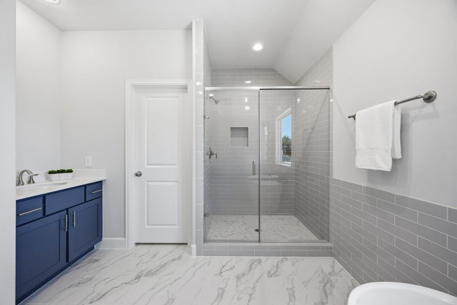 Shower in Style: Revel in the expansiveness of a large shower, standard with sleek finishes and a built-in niche, keeping essentials elegantly within reach.
