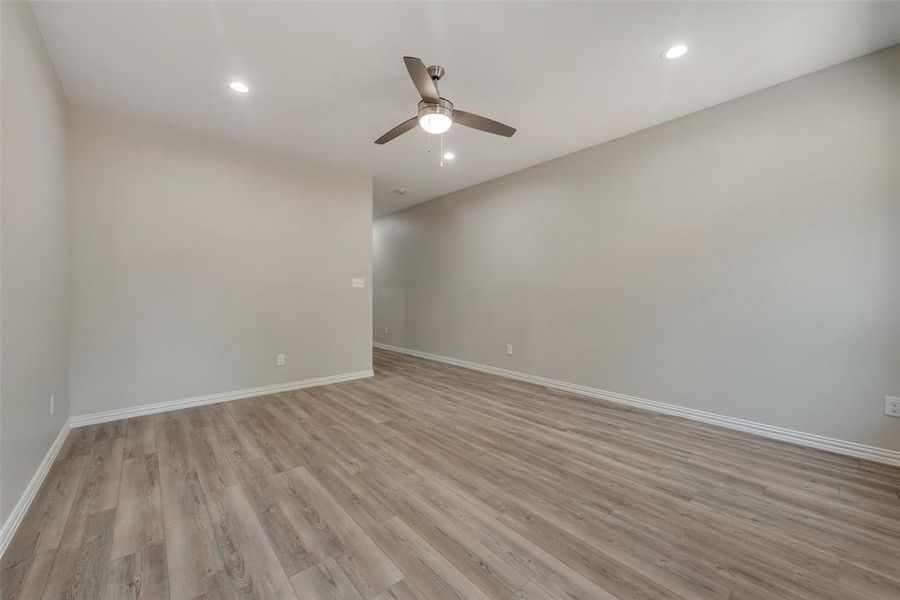 Unfurnished room featuring light hardwood / wood-style flooring and ceiling fan