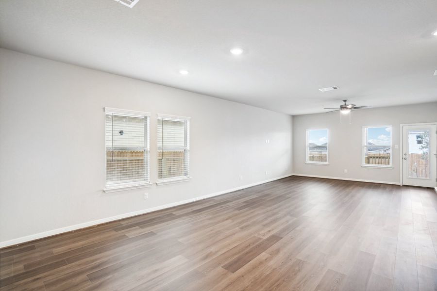 Dining room and living room of the Reynolds floorplan at a Meritage Homes community.