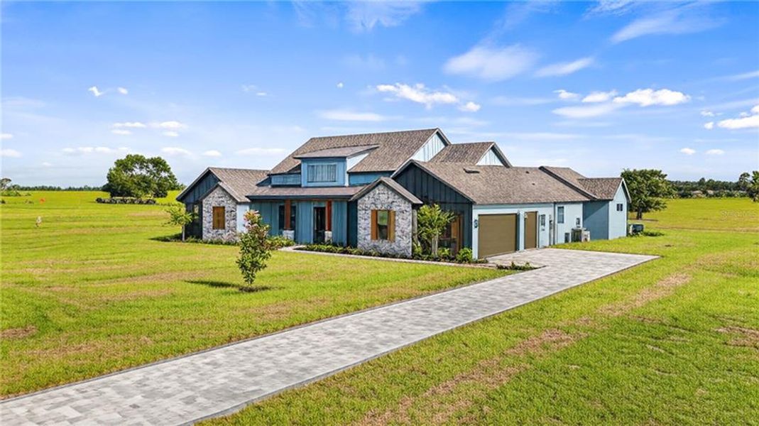 Front exterior of a new home in , Clermont, FL, highlighting curb appeal (Image 2).